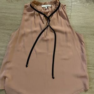 Women’s nude color blouse with no sleeves. Tie around neck.